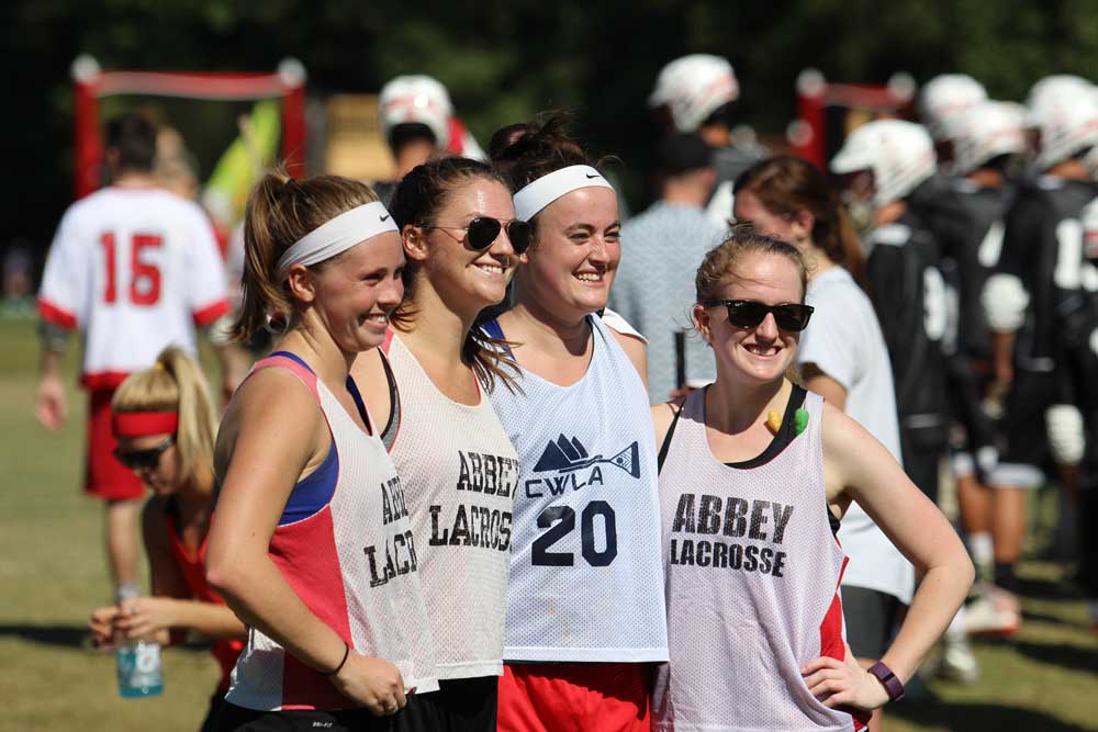 2015 Graduates, former Women's Lacrosse teammates, and suitemates pose, for a picture before the match!
